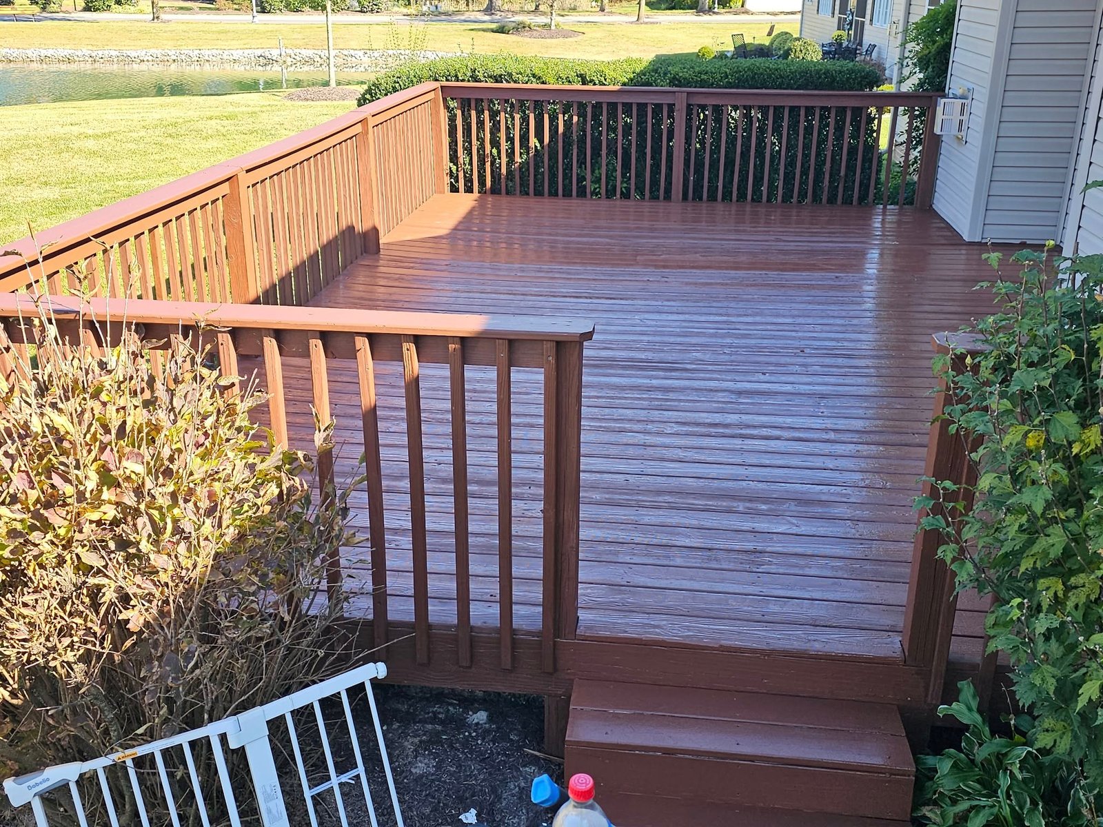 Finished wood deck with stairs and railing